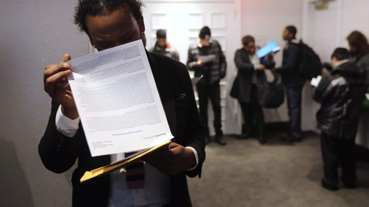 A man reading over his resume