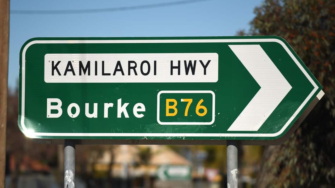 A roadside sign pointing the way to Bourke