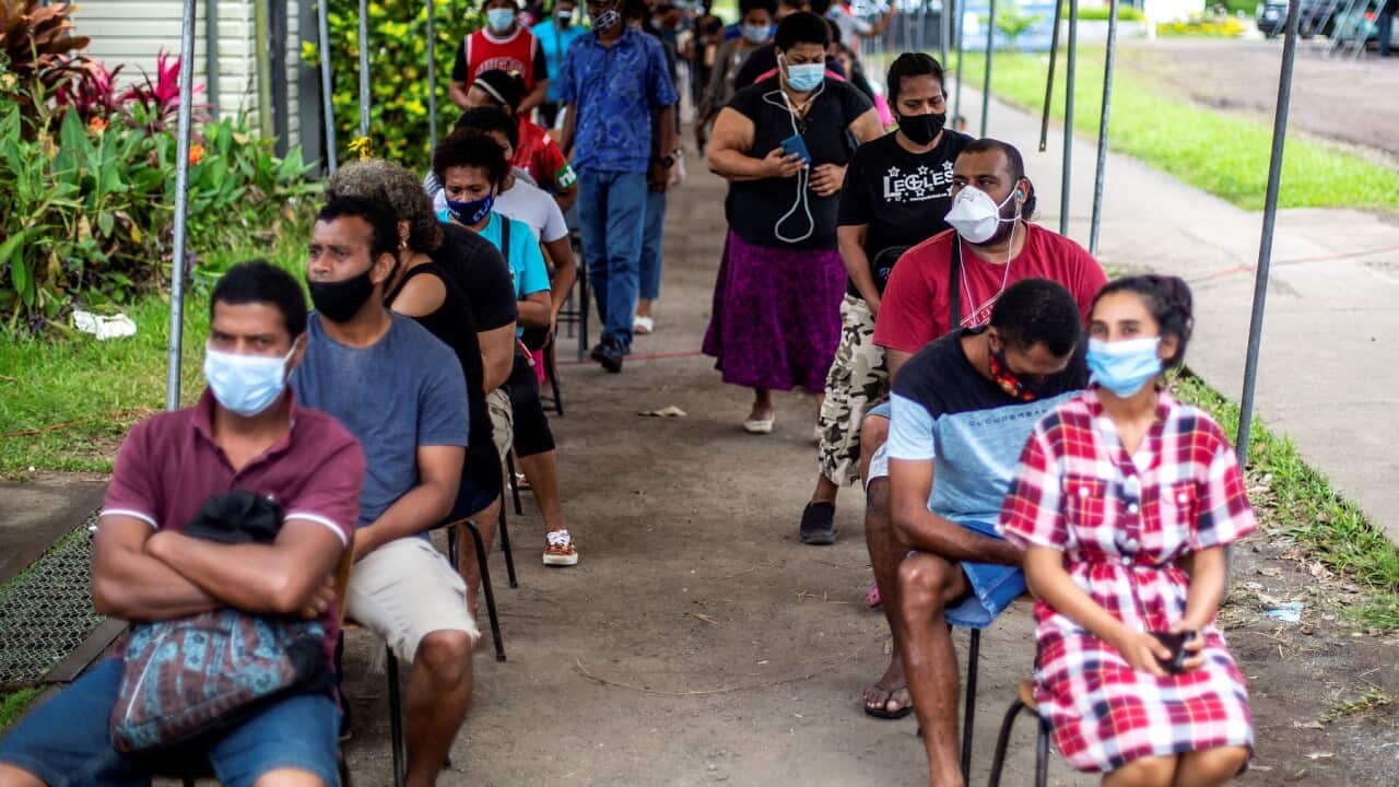 Residents wait for their dose of AstraZeneca vaccine in Suva