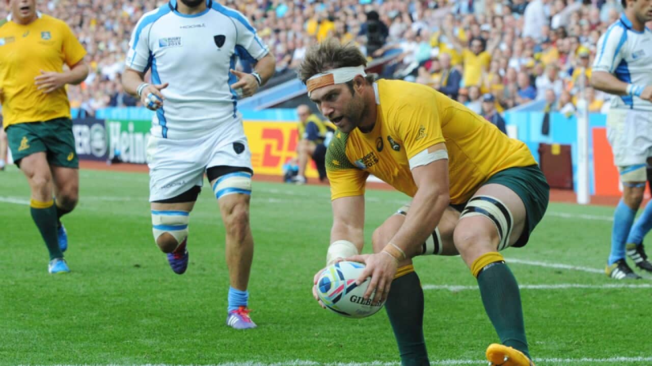 Australia's Ben McCalman scores a try against Uruguay