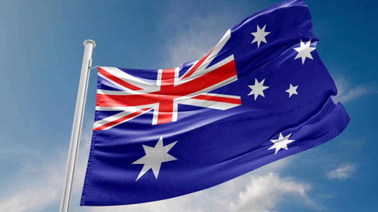 Australian flag is waving at a beautiful and peaceful sky in day time while sun is shining. 3D Rendering