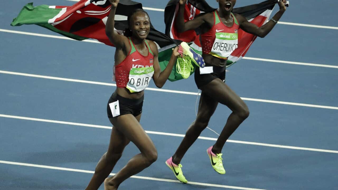 Kenya's Vivian Jepkemoi Cheruiyot (R) and Hellen Onsando Obiri