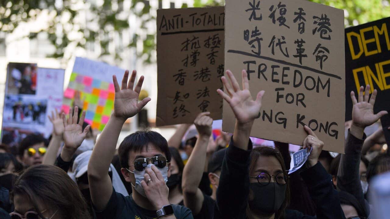 Pro democracy supporters are seen during a Hong Kong pro-democracy demonstration in Sydney, Sunday, September 29, 2019. (AAP Image/Steven Saphore) NO ARCHIVING