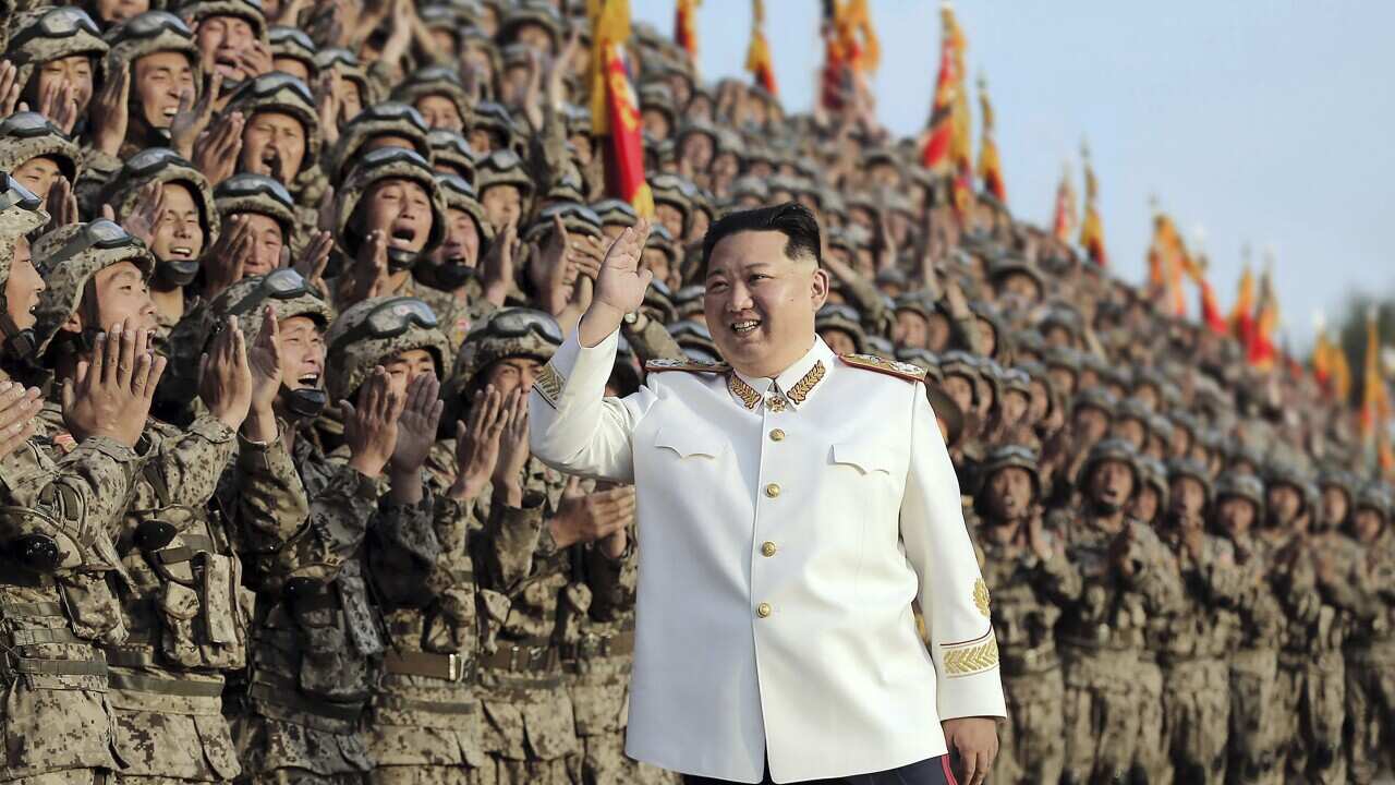 North Korean leader Kim Jong Un acknowledges the officers and soldiers who took part in a celebration the 90th founding anniversary of the Korean People's Revolutionary Army, in North Korea Wednesday, April 27, 2022