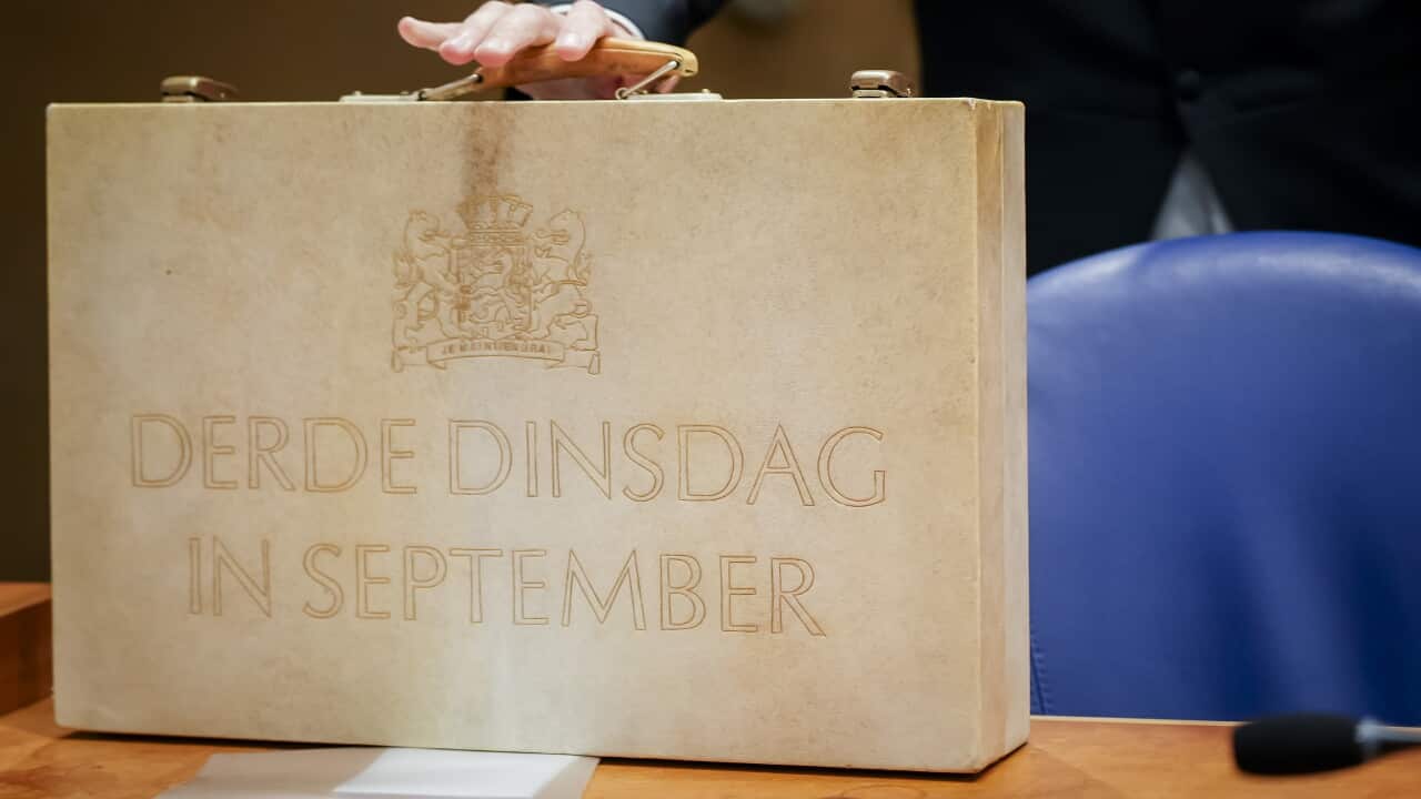 Prinsjesdag: Minister of Finance presents briefcase package with Budget Memorandum to the House of Representatives