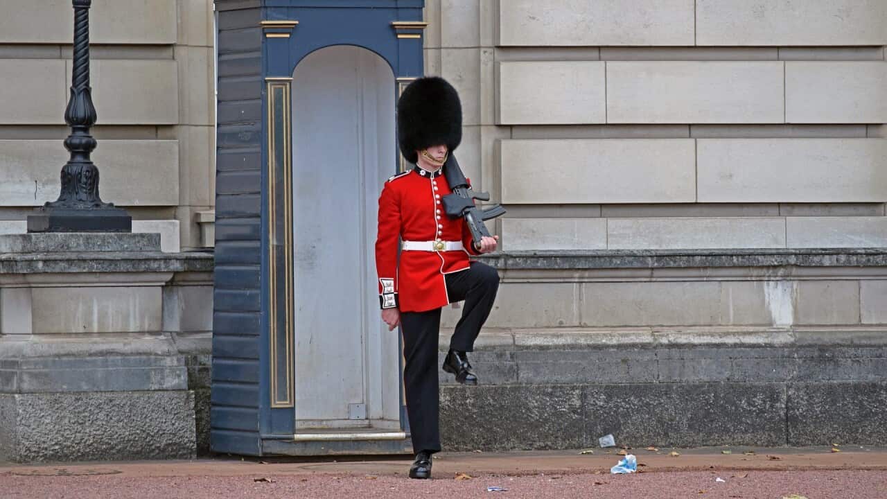 A soldier of the Queen's Guard in front of Buckingham Palace.