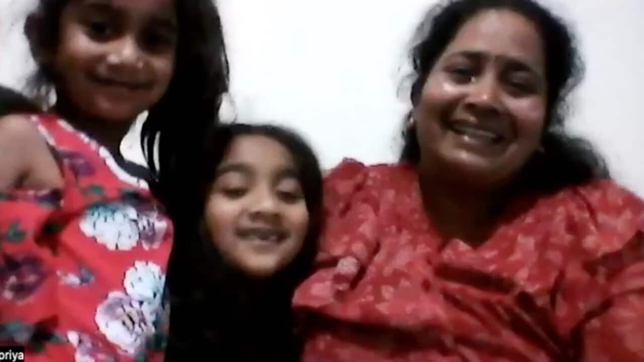 A supplied image obtained on Sunday, May 22, 2022, shows Priya and her two girls, currently in Perth, Western Australia, hearing the news that they will likely be allowed to return home to Biloela, Queensland. The Tamil family fighting for years to return