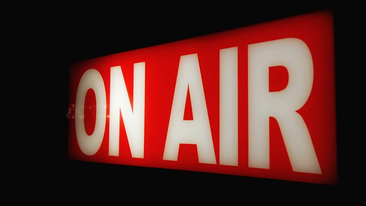 Close-Up Of Illuminated On Air Sign Against Black Background
