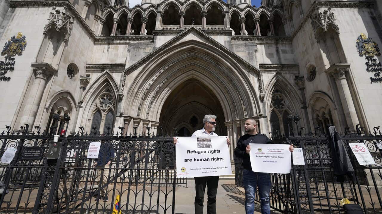 Pro-refugee protesters outside court in London (AAP).jpg