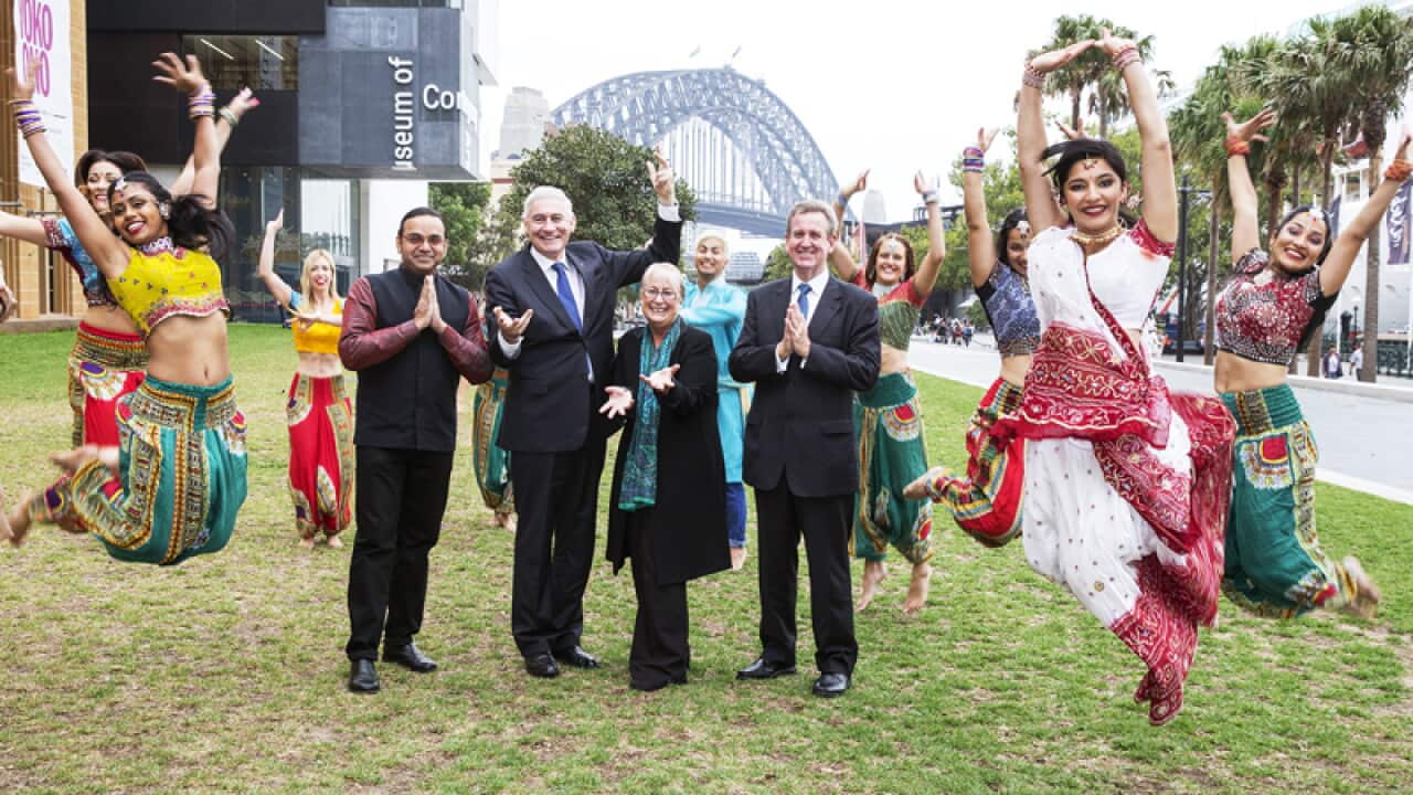 NSW Premier Barry O'Farrell poses with Jhappi Time dancers.