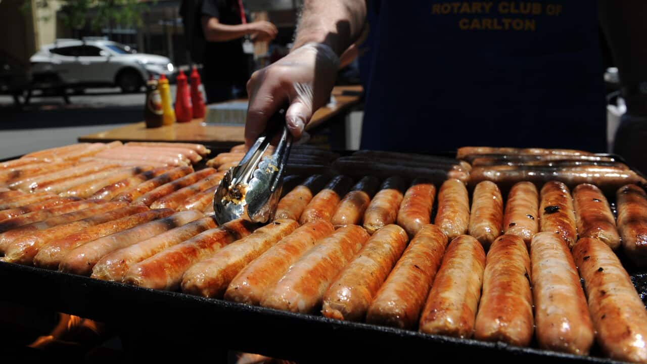 A sausage sizzle is seen outside a polling station at University High School in Melbourne, Saturday, Nov. 29, 2014. Opinion polls are predicting an ALP government.