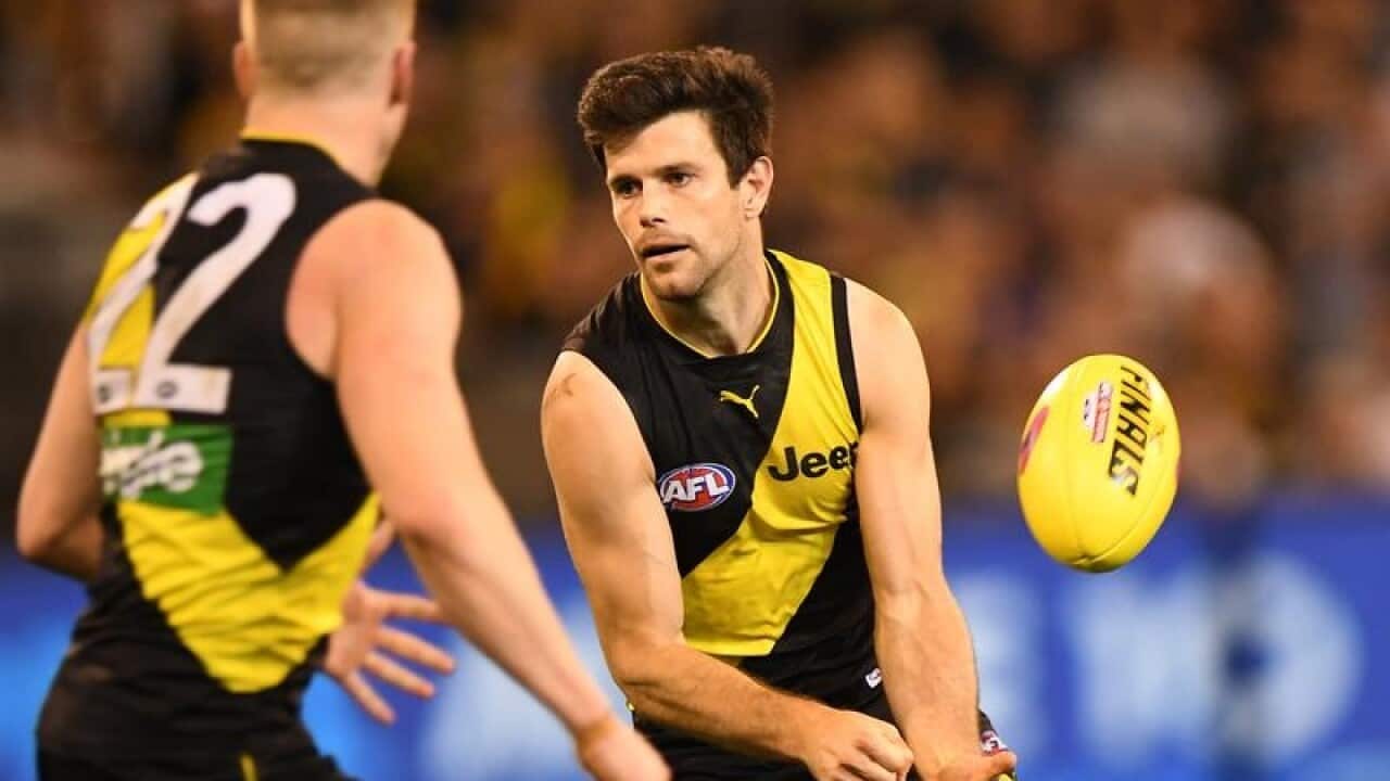 Trent Cotchin of the Tigers is seen in action.