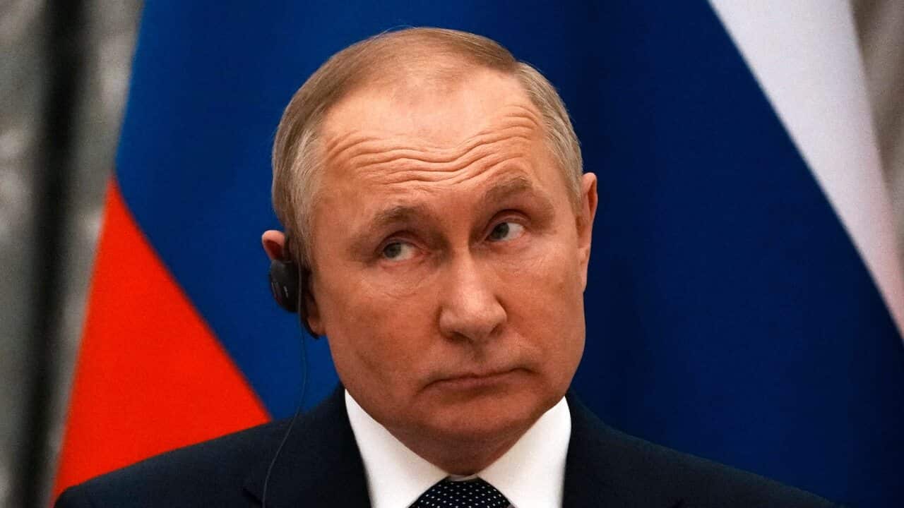 Russian President Vladimir Putin reacts during a joint press conference with French President Emmanuel Macron after their talks in Moscow on 7 February 2022.