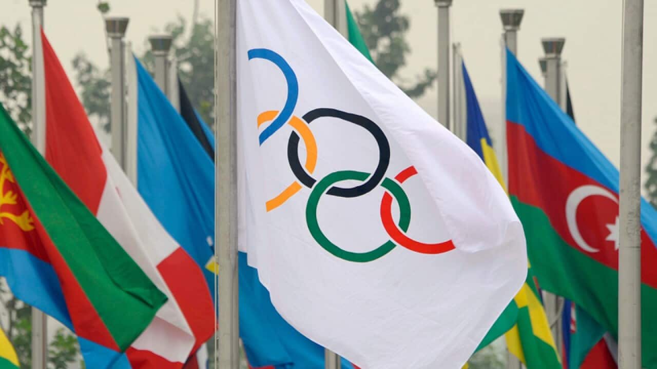The Olympic flag with competing national flags