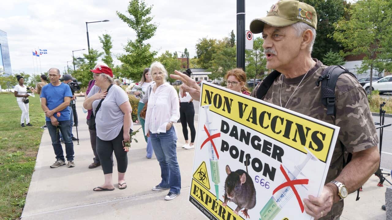 An anti-vaccine protester demonstrates in front of a hospital in Montreal, on Monday, Sept. 13, 2021. (Paul Chiasson/The Canadian Press via AP)