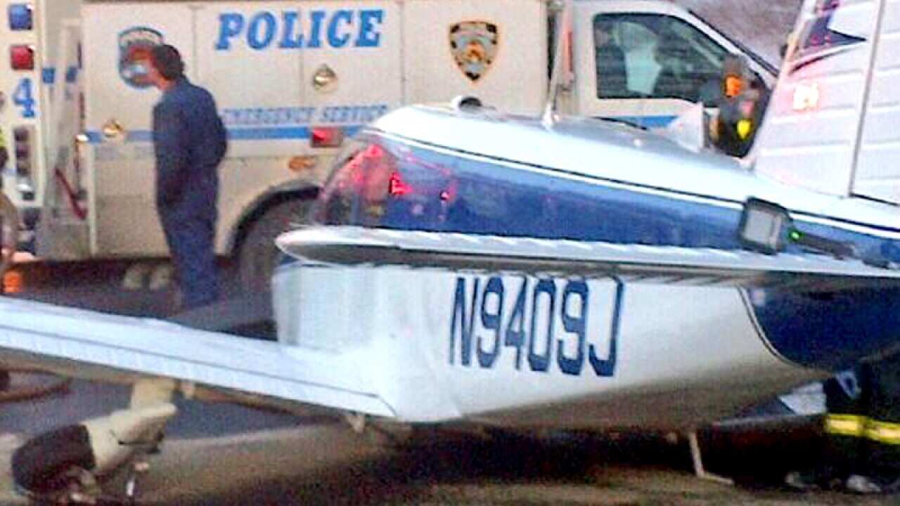 A light airplane on the road after it made an emergency landing in NY