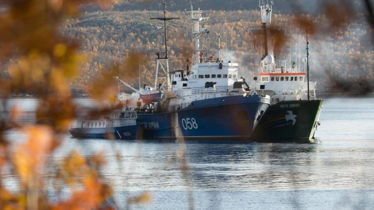 A Russian ship inspects the Greenpeace ship, Arctic Sunrise, Murmansk