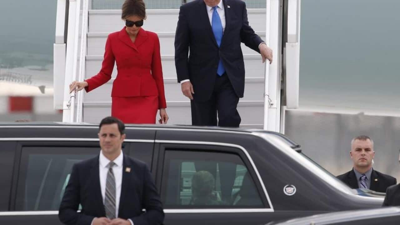 Donald Trump and First Lady Melania arrive at Orly airport