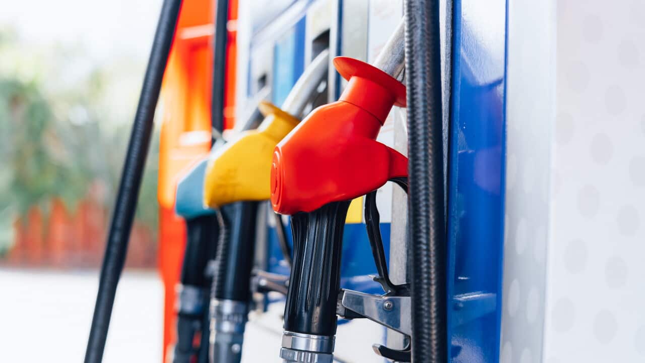 Close-up of colourful fuel pumps at a petrol station.