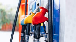 Close-up of colourful fuel pumps at a petrol station.