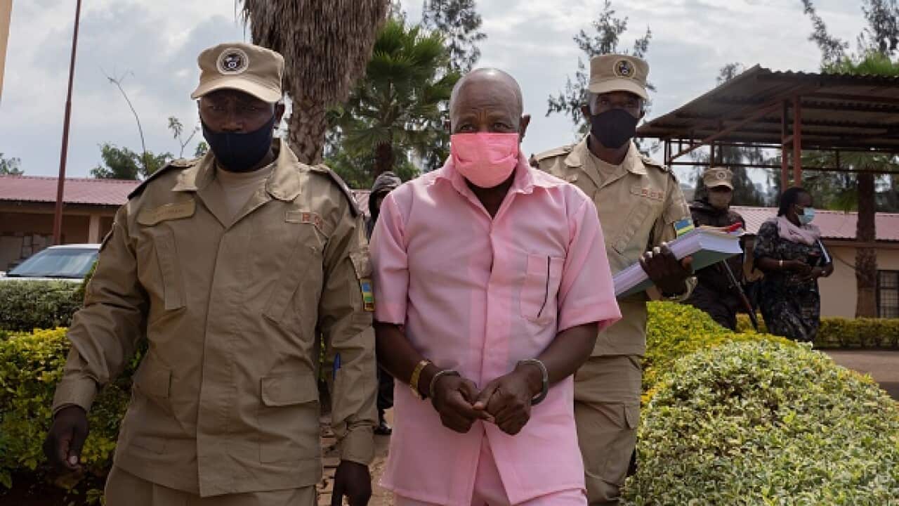 Paul Rusesabagina in the pink inmate's uniform arriving at Nyarugenge Court of Justice in Kigali, Rwanda, on October 2, 2020.