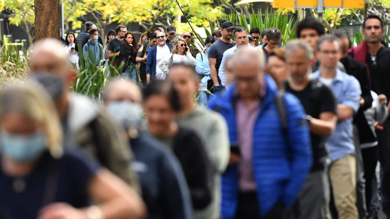 Members of the public wait in line at a mass COVID-19 vaccination hub in Sydney on Monday, 24 May, 2021.