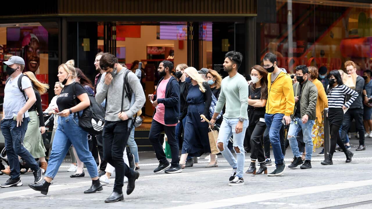People walking down a street in Sydney's CBD