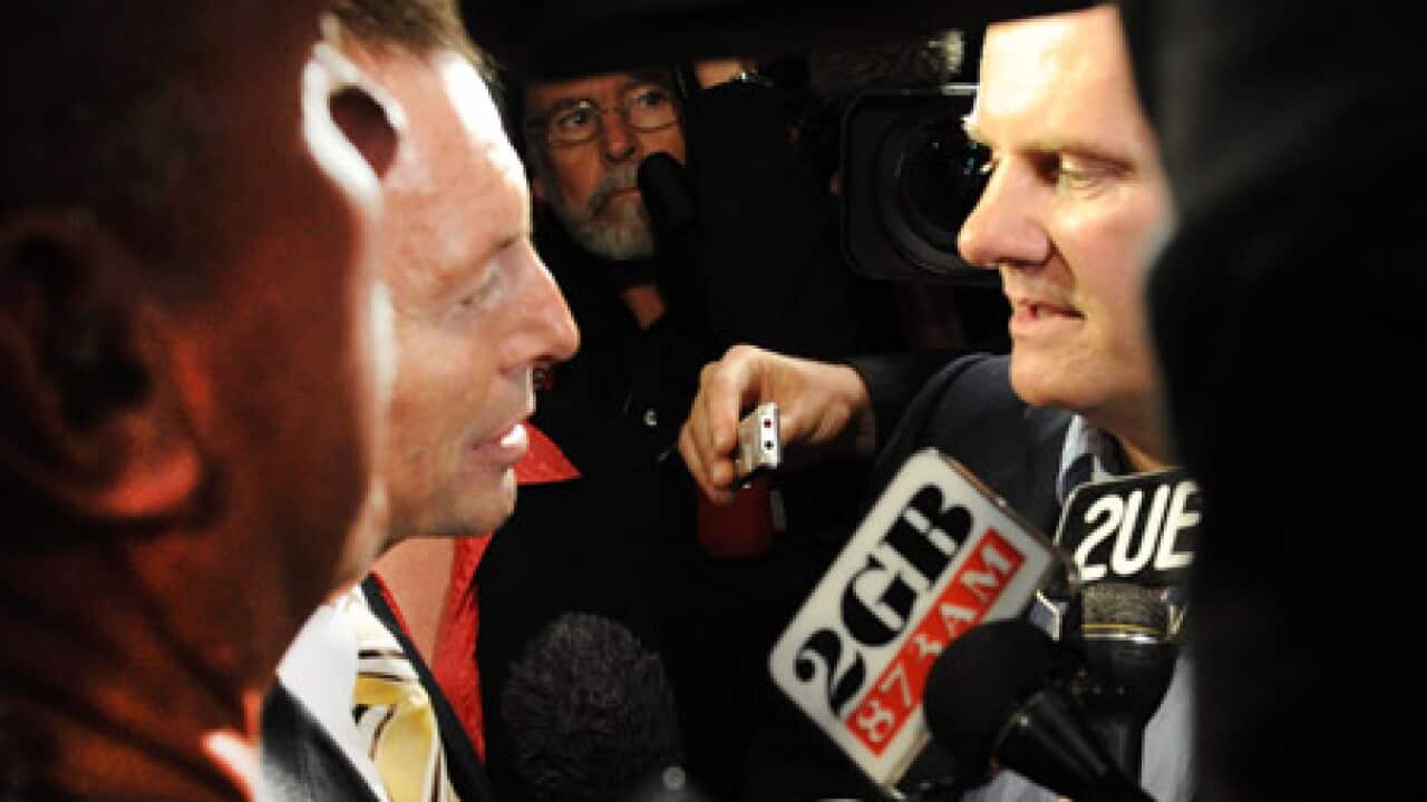 latham_abbott_100812_B_AAP_1357221640