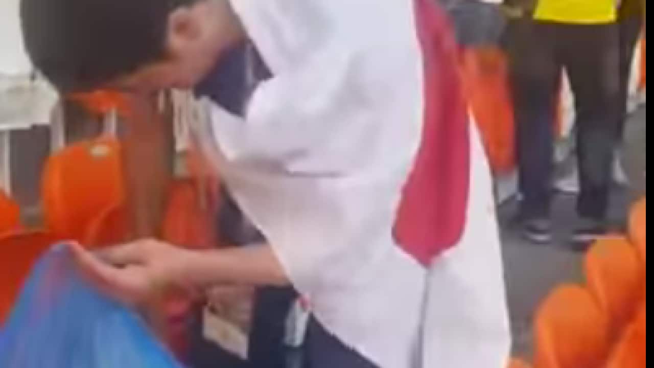 Japanese fan collecting rubbish