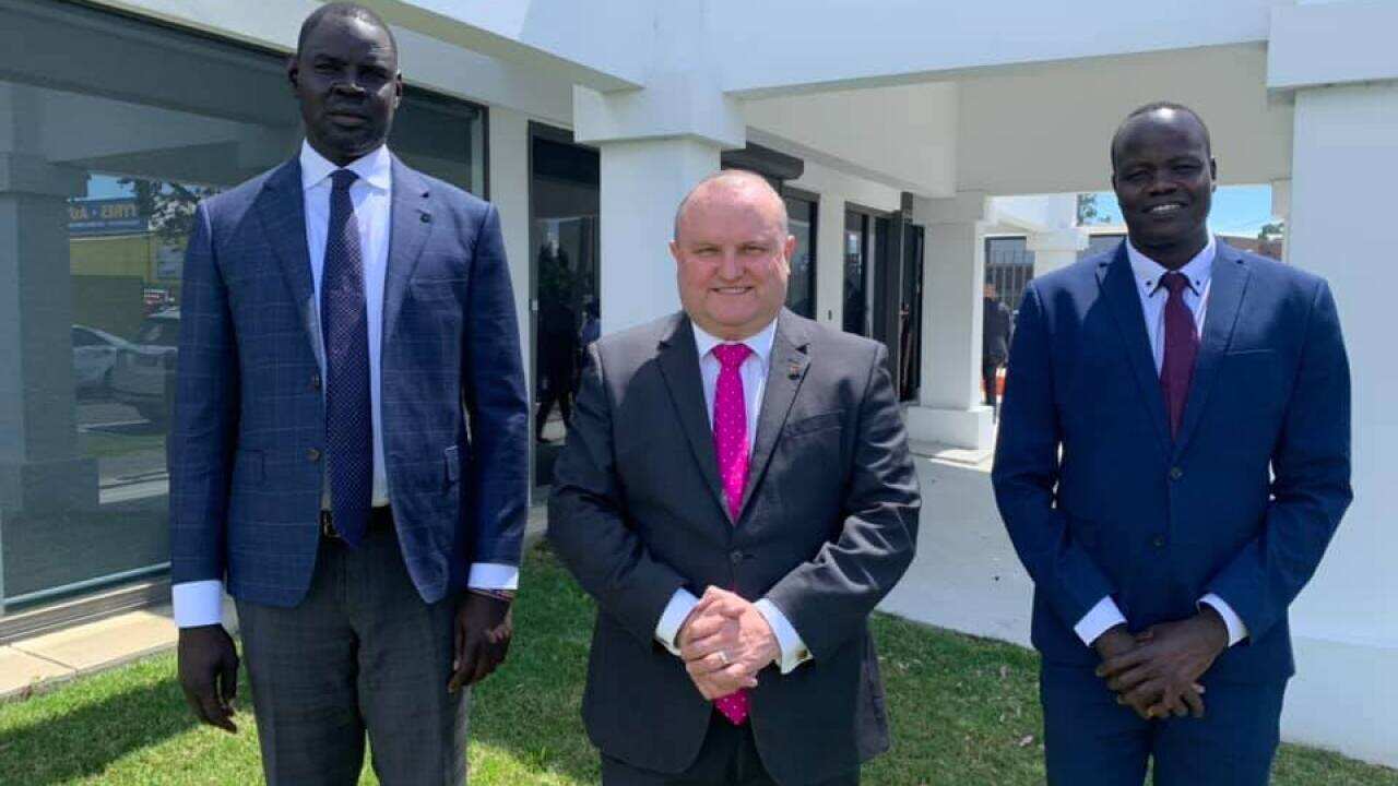 Bol Machar and his colleague at the office of Hon Assistance minister for Customs, Community Safety and Multicultural Affairs Jason Wood