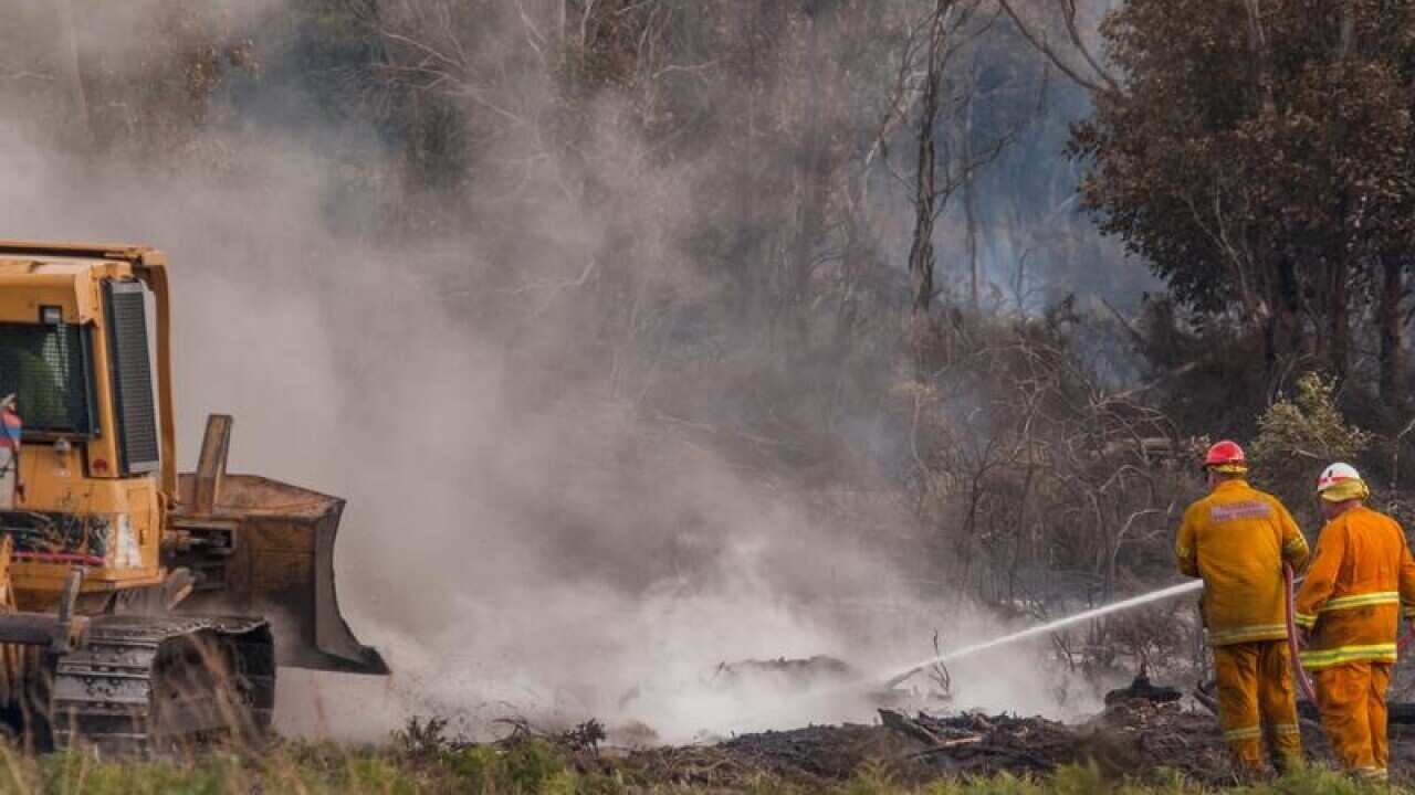 Firefighters battling the fire at George Town