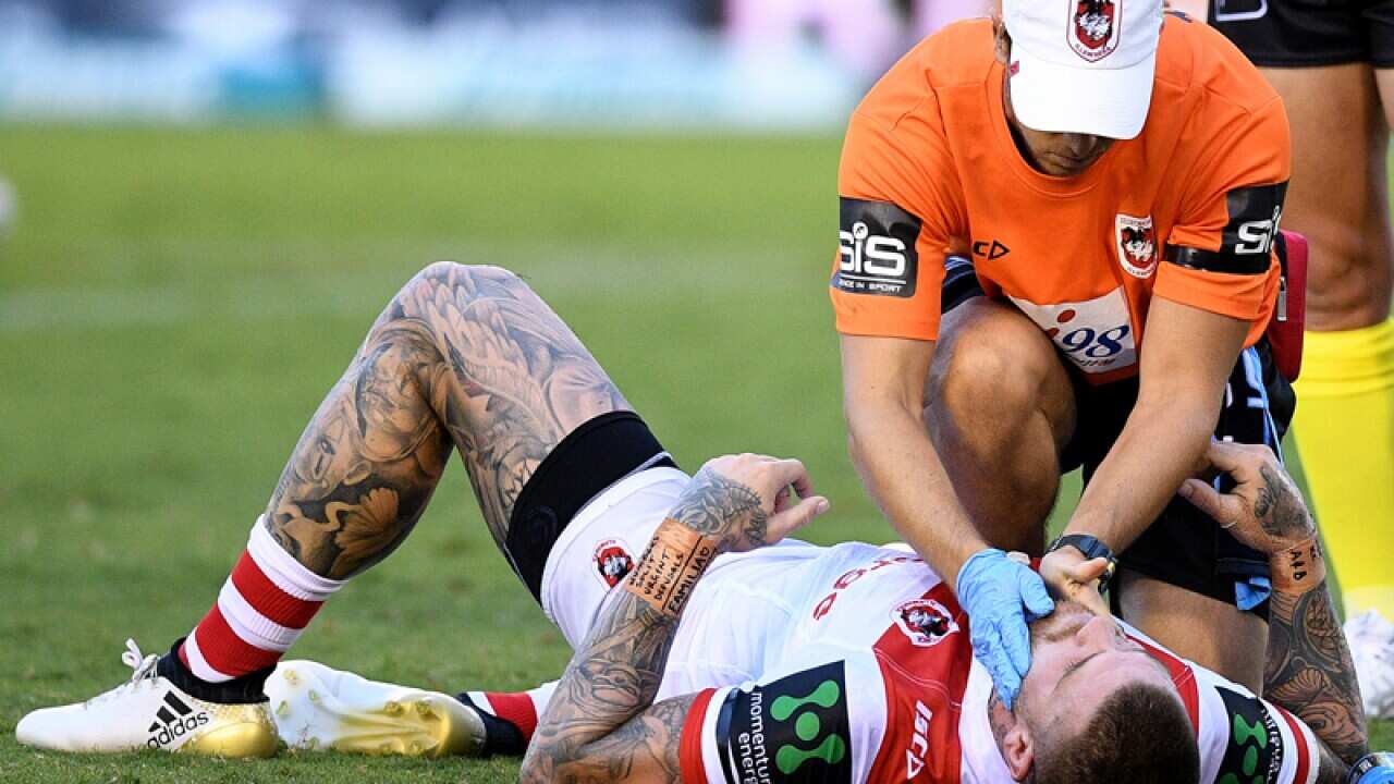 Josh Dugan lies on the ground after getting injured