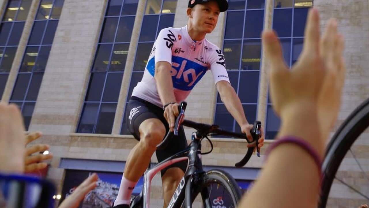 British cyclist Chris Froome rides his bike on stage.