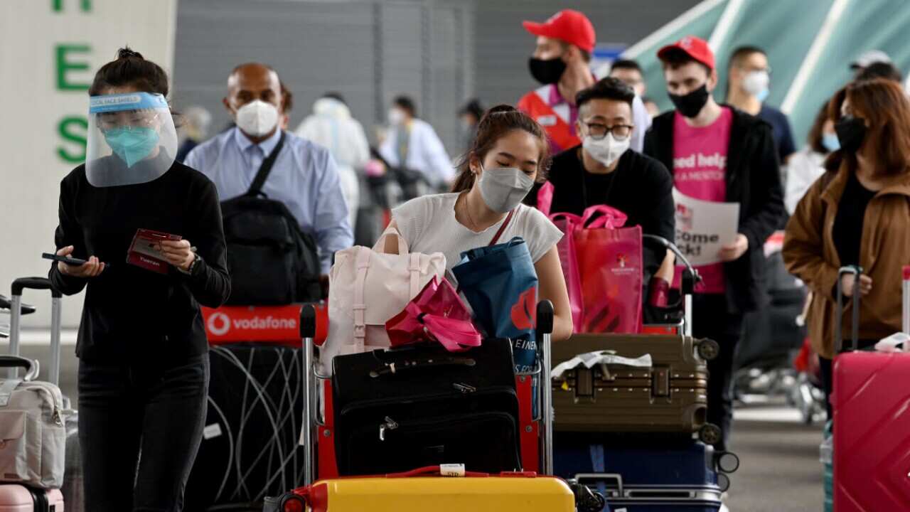 International travellers arriving at Sydney Airport on 6 December, 2021.