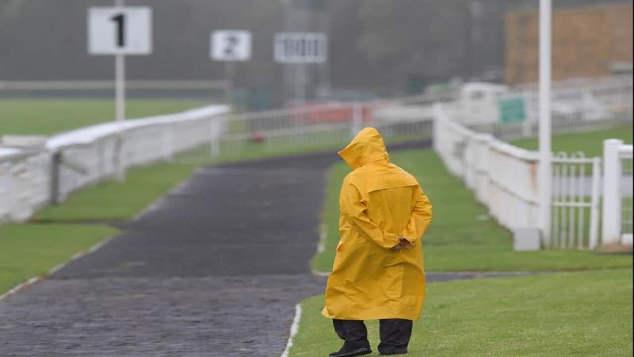 A groundsman is seen during a race meet in Gosford