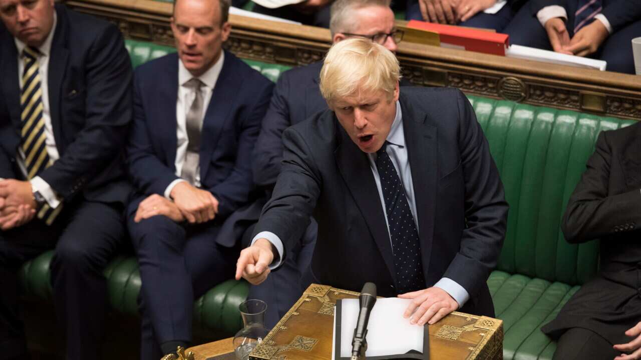 British Prime Minister Boris Johnson gesturing during a dramatic session in the House of Commons