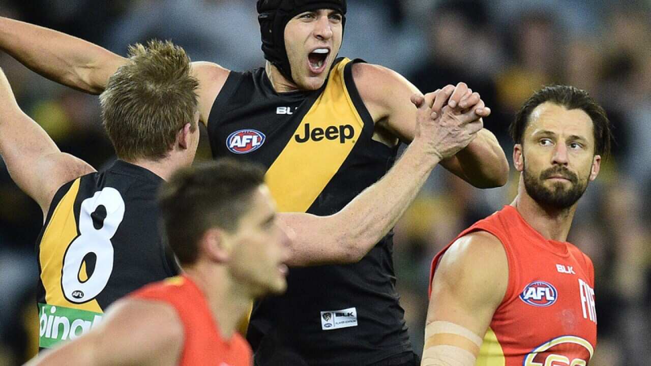 Ben Griffiths of the Tigers (third from left)