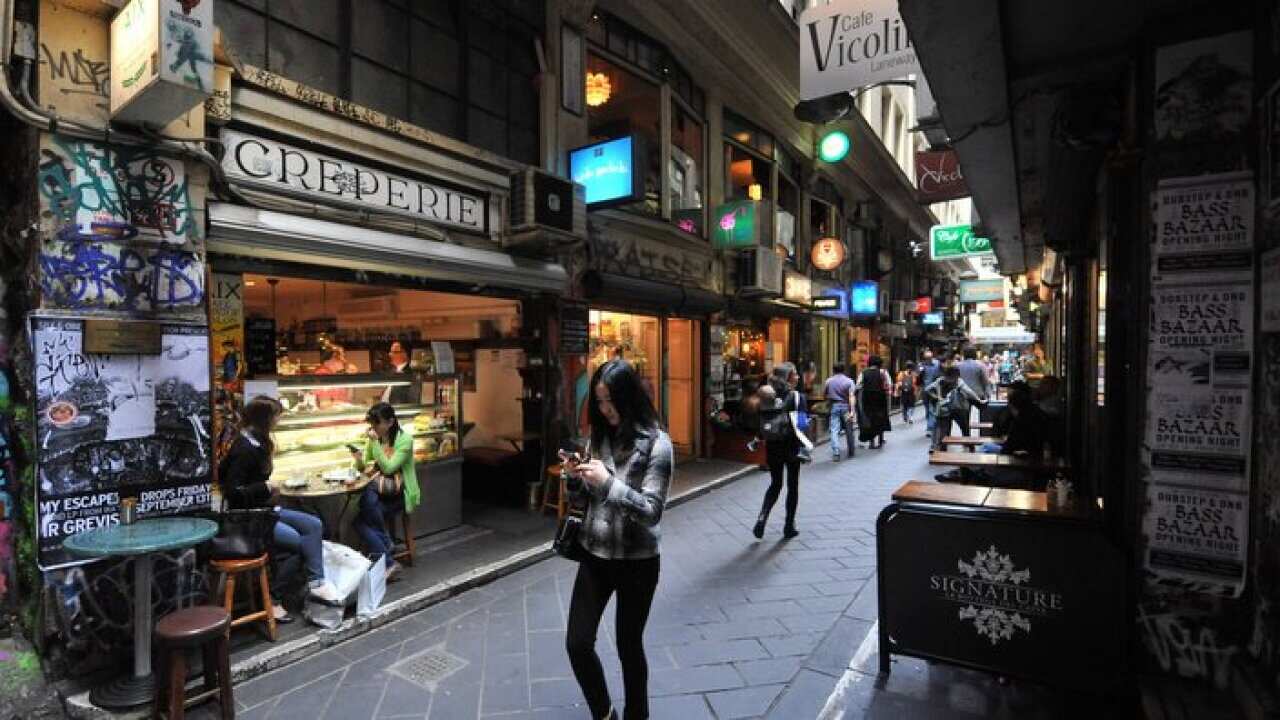 Pedestrians walk in Degraves Street in Melbourne