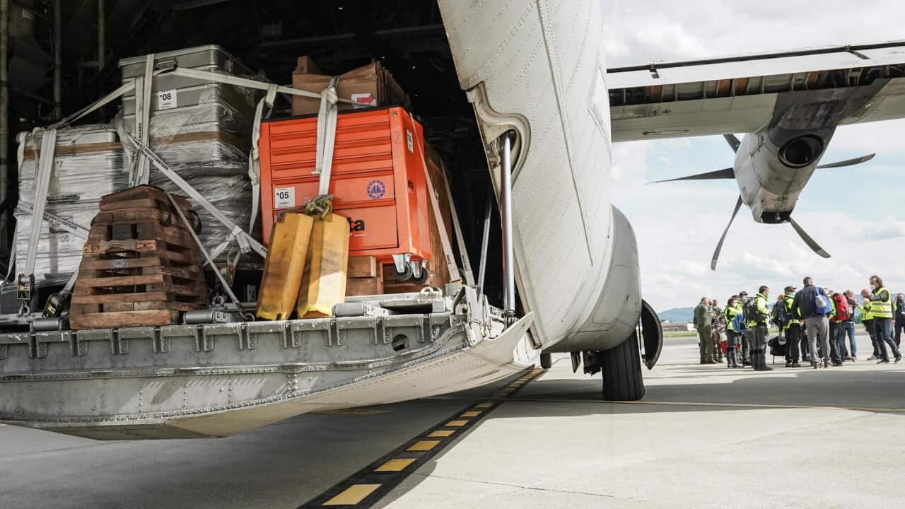 Oxygen production equipment is loaded onto a cargo aircraft in Italy, bound for India