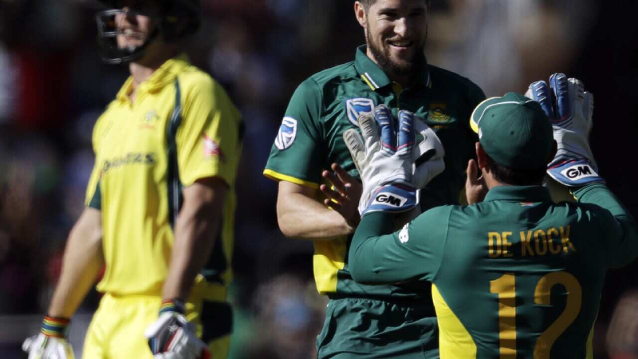 South Africa’s bowler Wayne Parnell, centre, celebrates