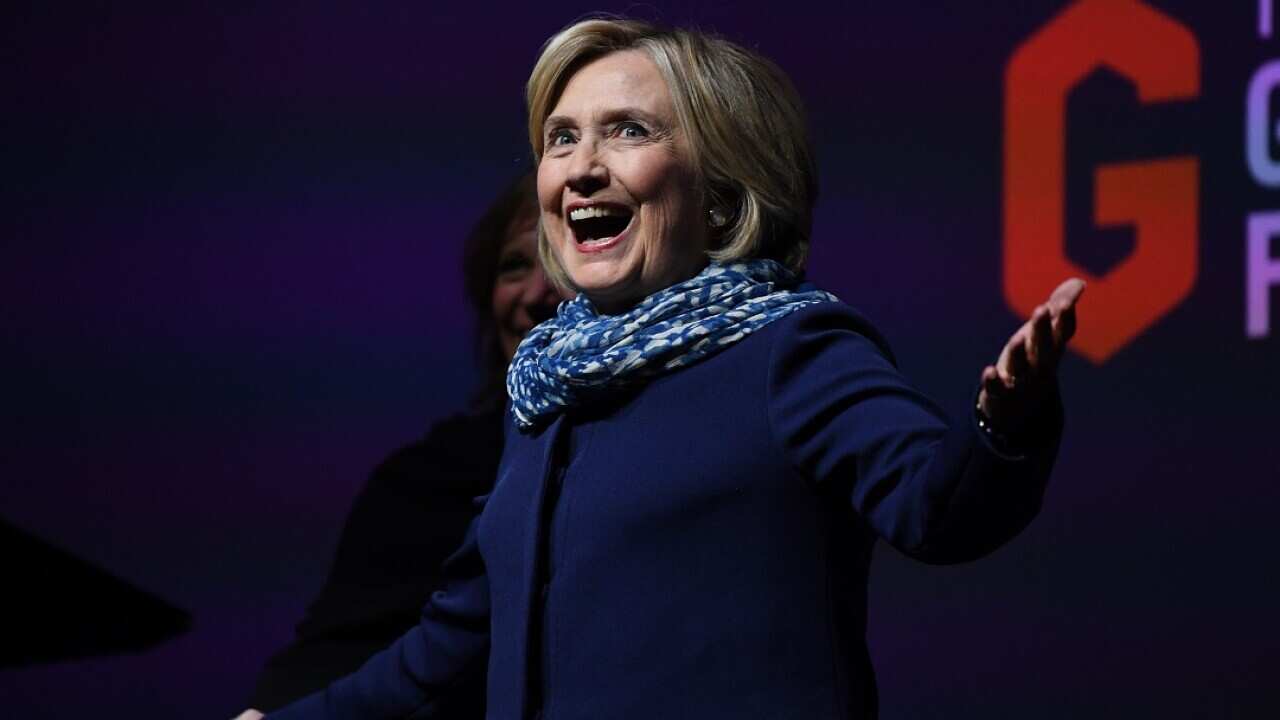Former US secretary of state Hillary Clinton gestures to the crowd as she walks on stage during a Women World Changers Series event at the ICC Sydney Theatre in Sydney, Thursday, May 11, 2018.  (AAP Image/David Moir) NO ARCHIVING