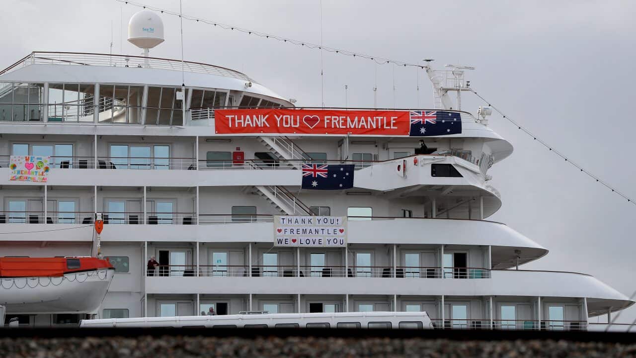Banners are hung from the cruise ship MV Artania in Fremantle harbour in Fremantle, Saturday, 28 March, 2020.