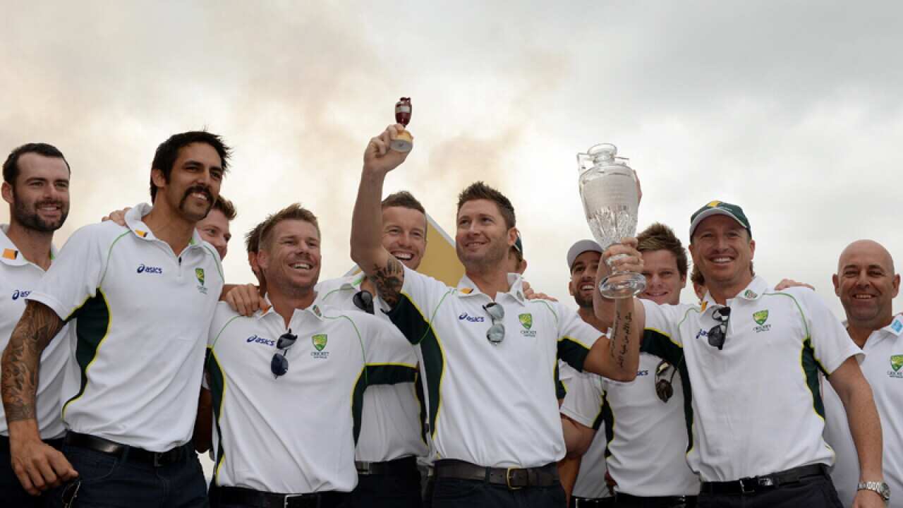 The Australian cricket team with a replica Ashes trophy
