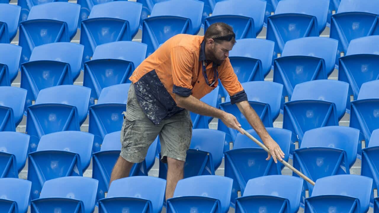 A workman is seen at the CBus Stadium on the Gold Coast,