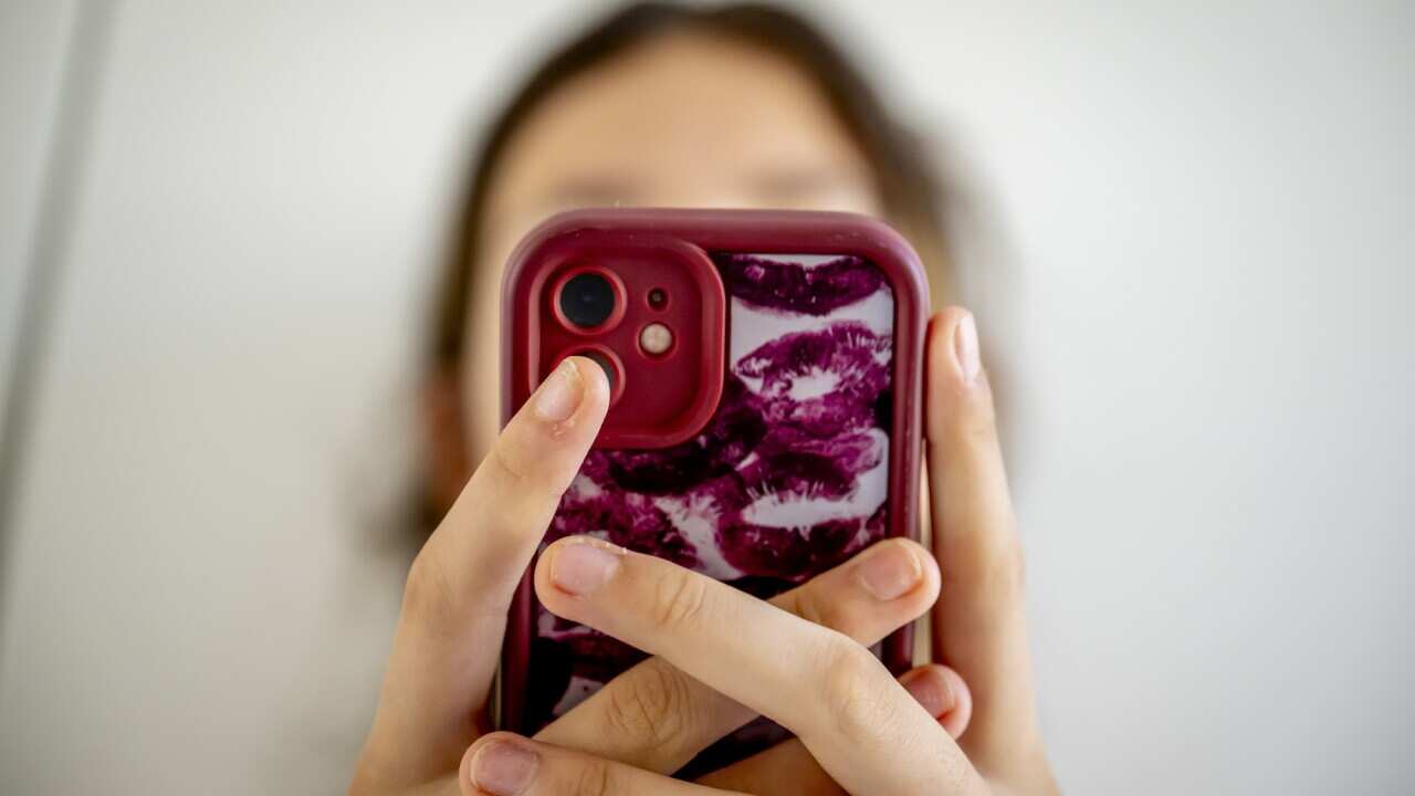 A teenage girl on her cell phone