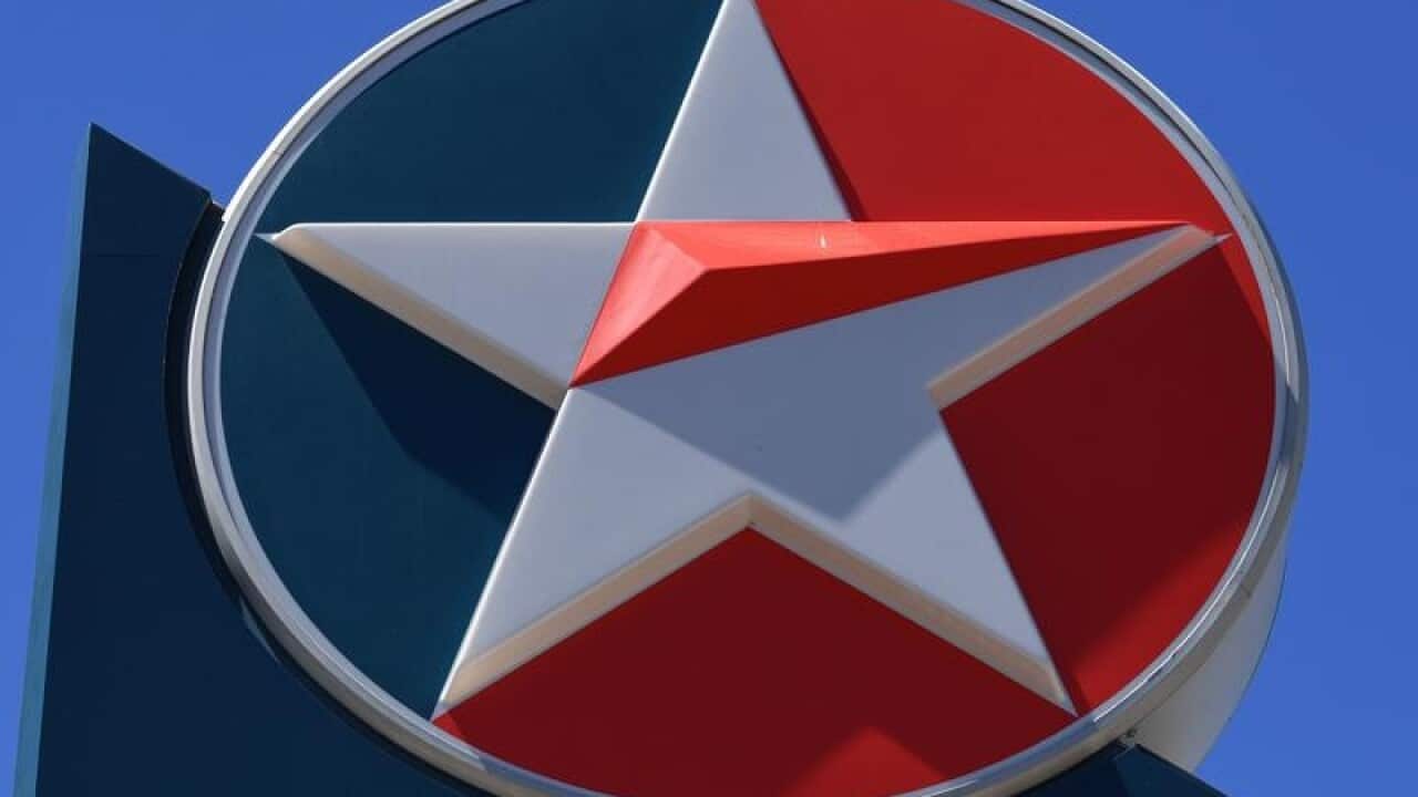 A 'Caltex' logo is seen at a petrol station.