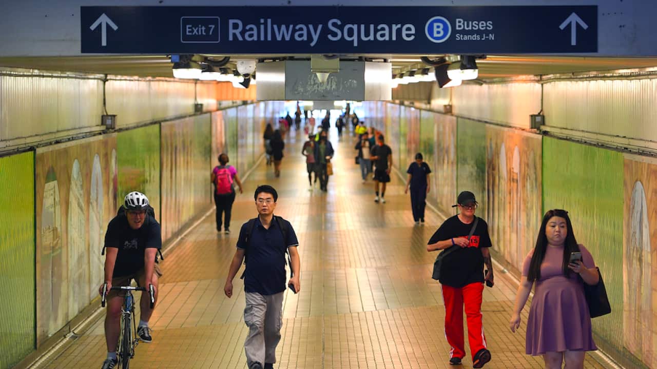 Commuters are seen at Central Station, Sydney.