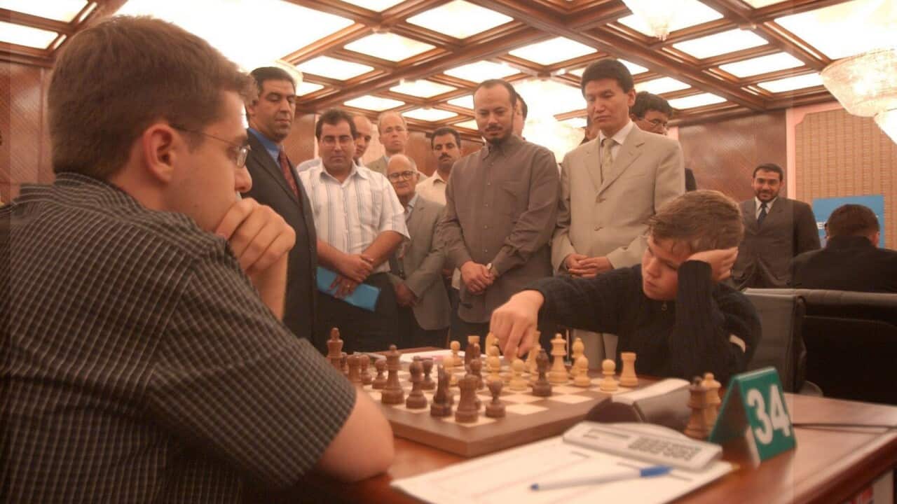 Norwegian chess player Magnus Carlsen (R) at the the world chess championship in Tripoli, Libya, 19 June 2004. He rose to fame after winning the C group of the Corus Chess Tournament at 13. (EPA/SABRI ELMHEDWI)
