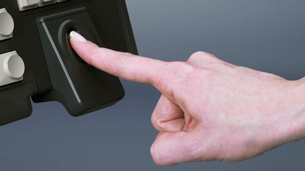 A women using a fingerprint scanner