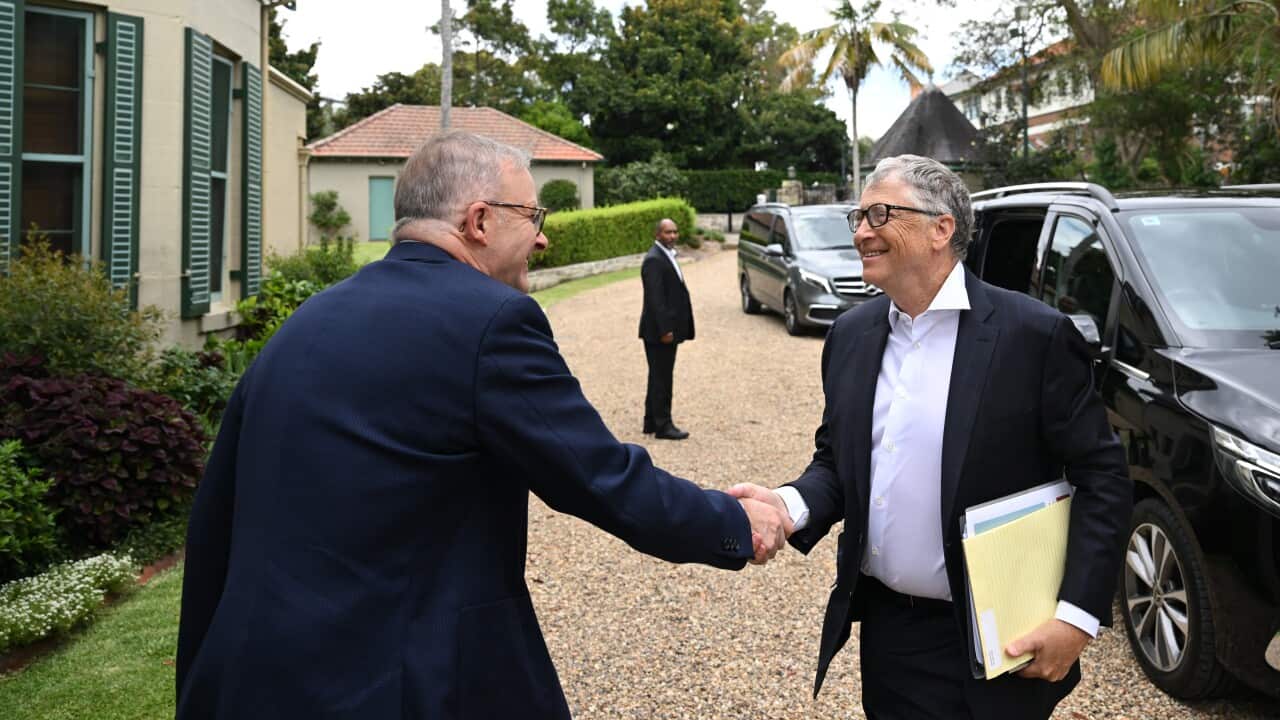 Anthony Albanese and Bill Gates standing on driveway shaking hands